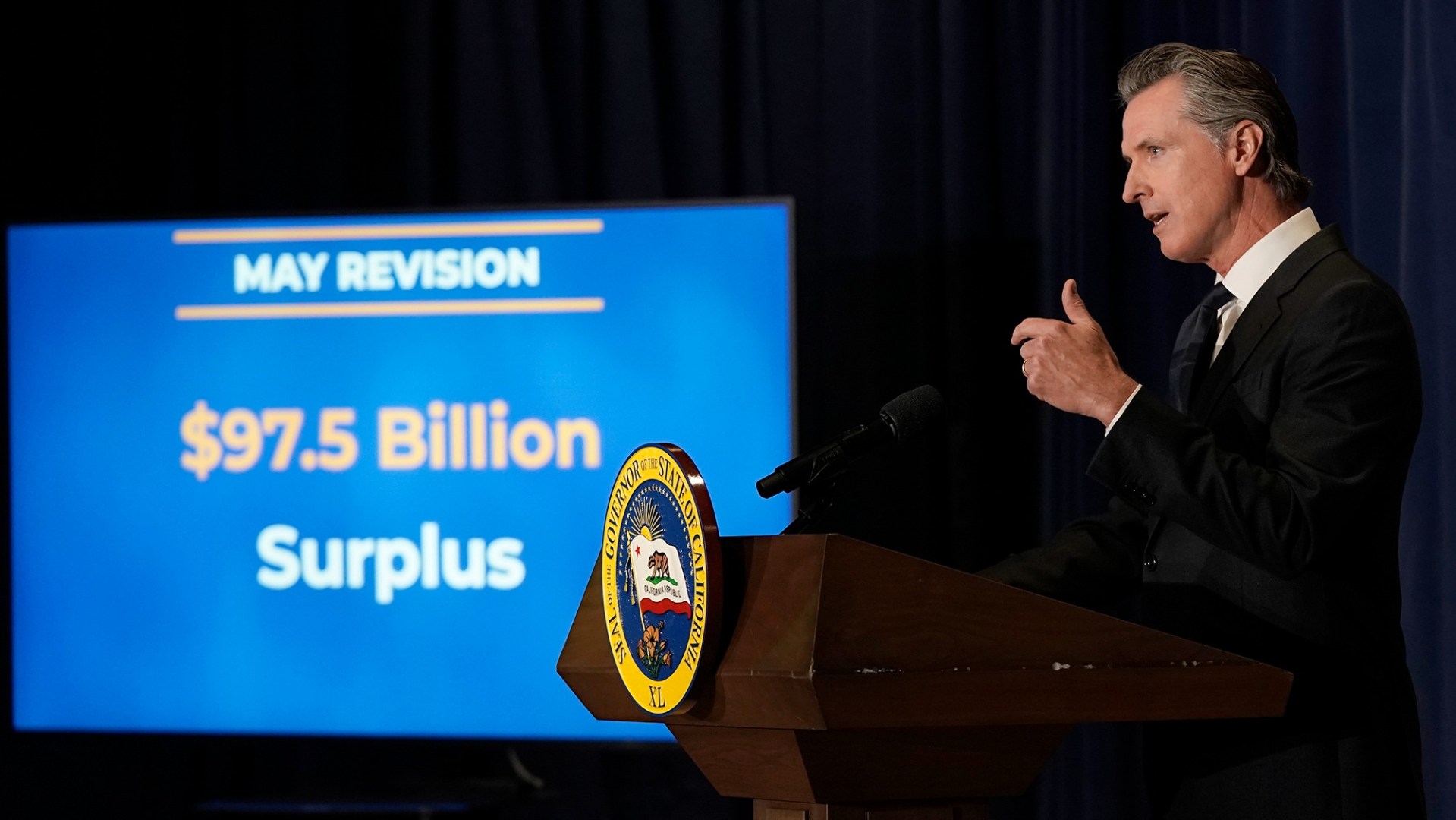 California Gov. Gavin Newsom unveils his 2022-2023 state budget revision during a news conference in Sacramento, Calif., Friday, May 13, 2022. California is expected have a record surplus. (AP Photo/Rich Pedroncelli,)